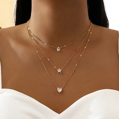 Colar Dourado com Pingentes Estrela, Gota e Coração – Camadas Modernas Femininas