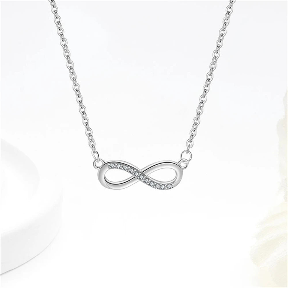 Conjunto Prata 925 Laço Móbio – Colar, Pulseira e Brincos com Cristais Zircônia