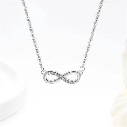 Conjunto Prata 925 Laço Móbio – Colar, Pulseira e Brincos com Cristais Zircônia